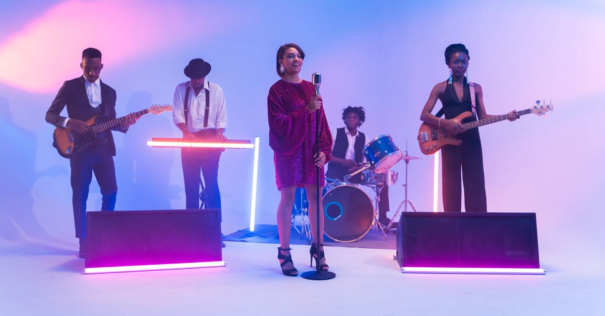Small stage with instruments and colored lights before a live show